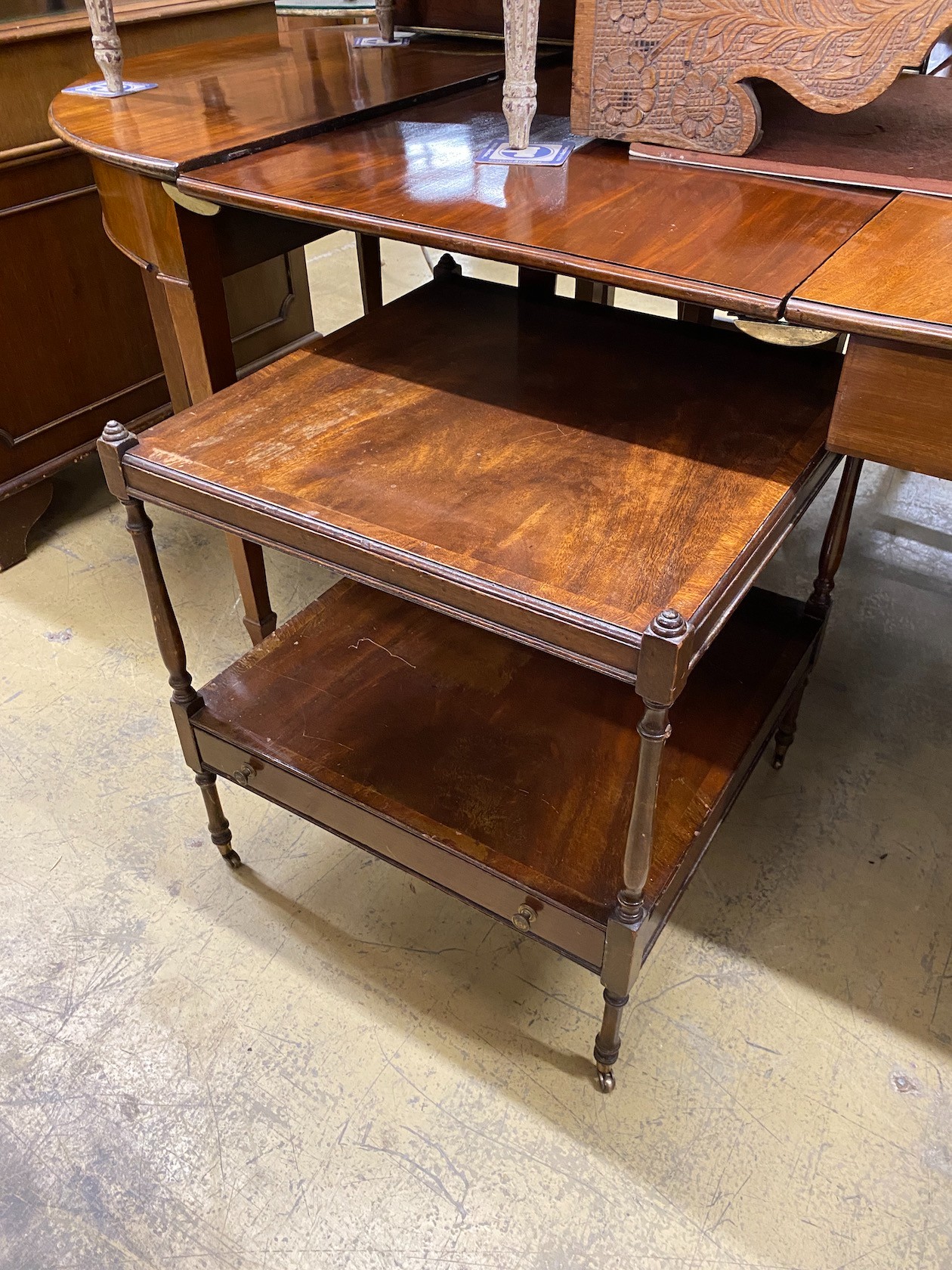 A pair of reproduction George III style mahogany two tier tables, width 56cm, height 60cm